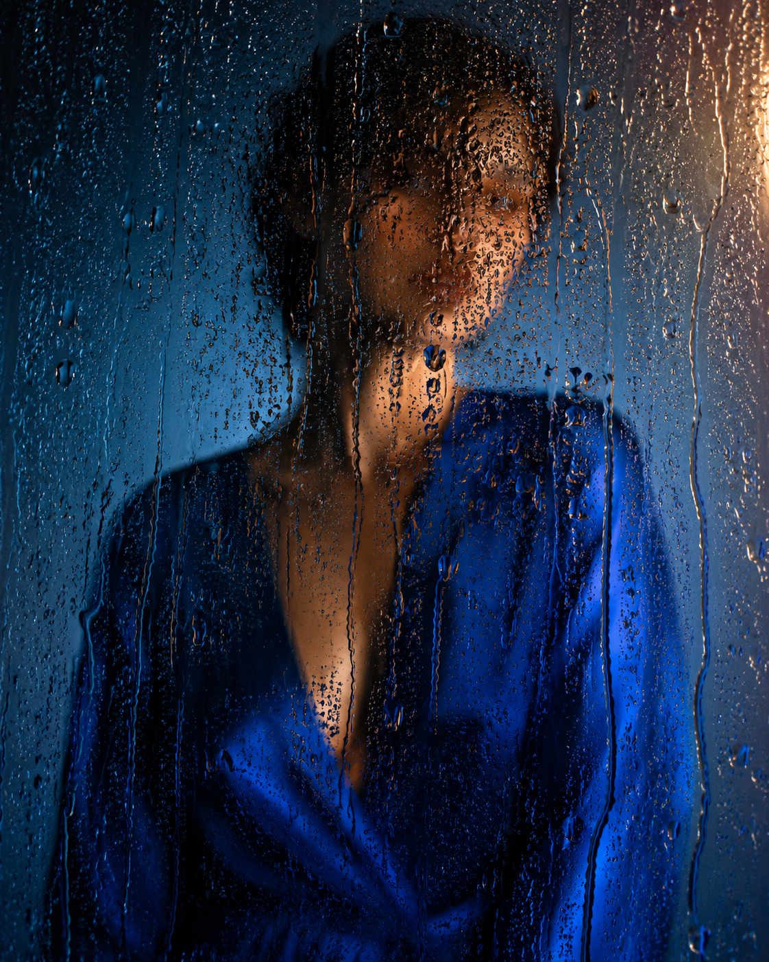 A cinematic editorial fashion photograph of a figure in a sa